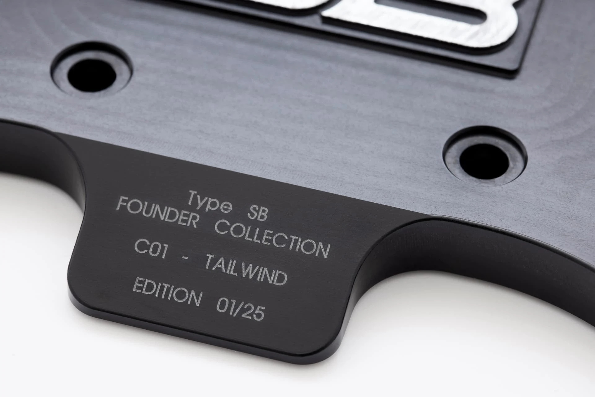 C01 Tailwind — laser-etched edition plaque, close detail
