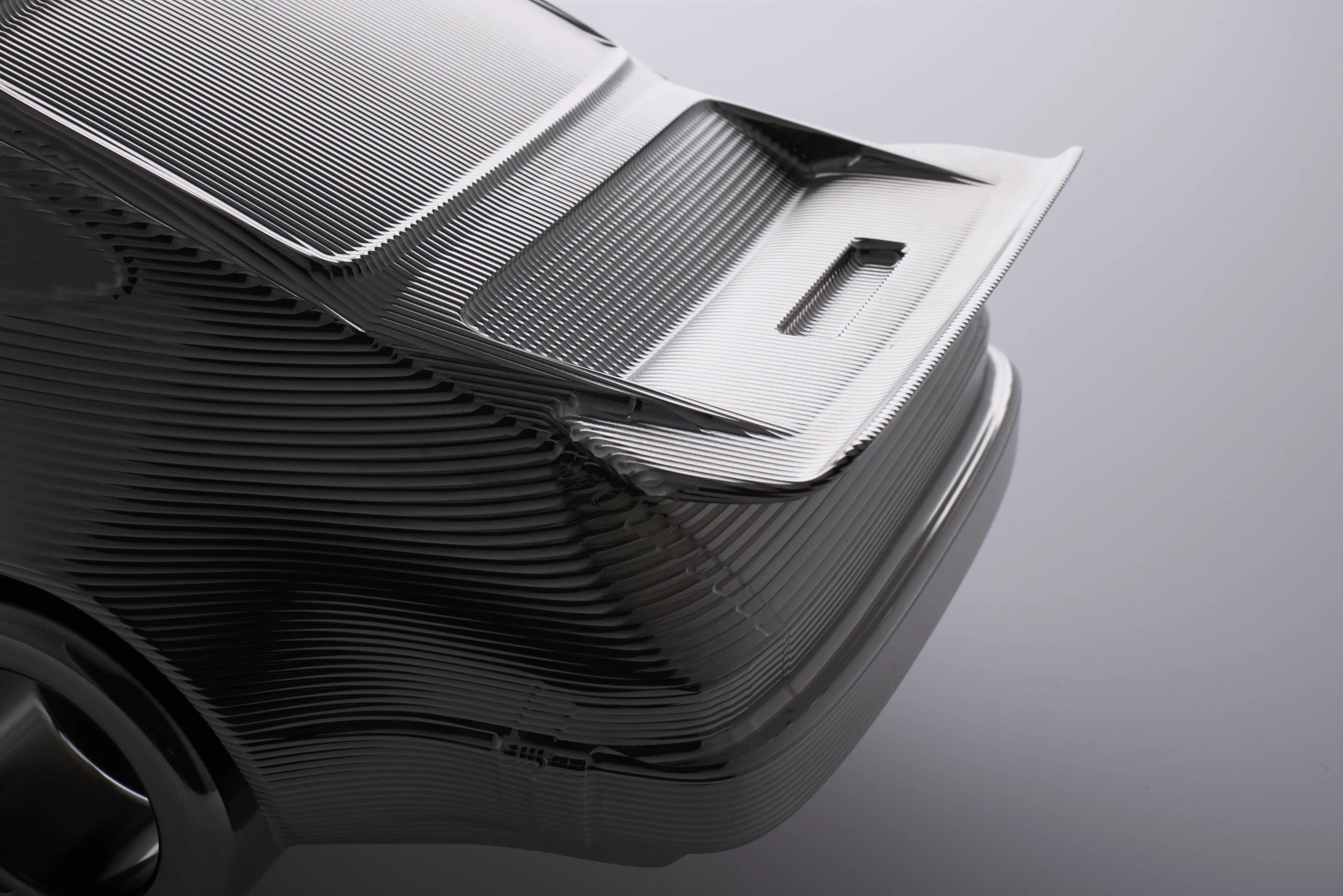 Machined billet aluminium rear form under studio light